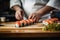 The culinary master\\\'s hands craft sushi rolls, showcasing Japanese cuisine\\\'s exquisite essence