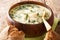 Cullen skink is a thick Scottish soup made of smoked haddock, potatoes and onions closeup in the plate. Horizontal