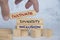 Cultivate diversity and inclusion text on wooden blocks. Respecting diversity concept