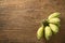 Cultivated banana on wooden background. Cultivated banana contain high calorie and Iron useful for healthy.