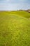 Cultivated Dutch dike landscape along the Wadden Sea in the north of Holland