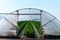 Cultivation of strawberry fruits using the plasticulture method, plants growing on plastic mulch in walk-in greenhouse tunnels