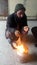 Cultural pathan sitting on fire in cold weather