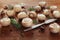 Cultured mushrooms champignons on wooden background