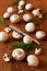 Cultured mushrooms champignons on wooden background