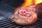 cumberland sausage, spiral pork sausage on bbq grill with flame,