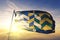 Cumbria county of England flag textile cloth fabric waving on the top sunrise mist fog