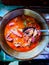 Cumi Balado or red chili squid. one of the typical Minangkabau dishes in Indonesia, fresh squid cooked with spicy chili sauce.