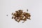 Cumin or Jinten spice is a traditional kitchen ingredients made of dried Cuminum cyminum seeds for cooking white background above