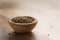 Cumin zira seeds in wood bowl on table