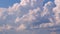 Cumulonimbus clouds build in a blue summer horizon.