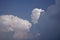 Cumulonimbus, nimbostratus and cumulus fluffy clouds .