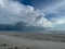 Cumulonimbus storm cloud hovering over Gulf of Mexico