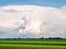 Cumulonimbus storm cloud over grassland of polder landscape in Friesland, Netherlands