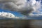 Cumulus clouds above the water surface