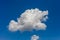 Cumulus clouds against a bright blue sky