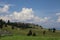 Cumulus clouds on blue sky, summer day in the mountains