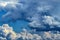 Cumulus clouds flowing across the summer sky