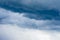 Cumulus clouds, navy blue bad weather sky, thundercloud and beginning of heavy rain