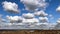 Cumulus clouds over the city timelapse in winter sunny day