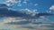 Cumulus rain cloud formations in open air float along sky