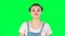 Cunning girl looking at camera, smiling with tight red lips on green screen. Slow motion