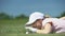 Cunning woman hitting golf ball in hole with finger, having fun during game
