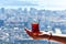 A cup armud of traditional Turkish tea in hand on the background of the Istanbul cityscape