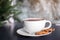 Cup of aromatic cacao with cookies on table. Space for text