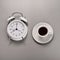 Cup of black coffee with alarm clocks