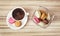 Cup of black coffee with french colorful macarons, view from above