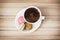 Cup of black coffee with tasty french colorful macarons, sweet d