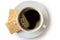 A cup of black coffee with two square shortbread biscuits isolated on white from above. White ceramic cup and saucer.