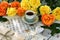 Cup of black tea with decorations, music sheet and yellow roses