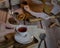 Cup of black tea with a freshly baled biscuit on a wooden table