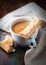 Cup of caffe crema with french pastries