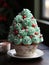 Cup cake with green whipped cream decorated as christmas tree