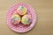 Cup cakes on a pink plate