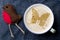 Cup of cappuccino coffee with foam in the form of butterfly on b