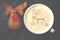 Cup of cappuccino coffee with foam in the form of reindeer on bl