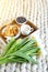 Cup with cappuccino and croissants, berries, white pastel giant knit blanket