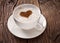 Cup of cappuccino with ground cinnamon in the form of heart.