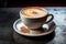 a cup of cappuccino sits on top of a saucer