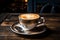 a cup of cappuccino sits on top of a wooden table