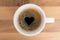 Cup of coffe with heart shape in foam