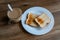 Cup of coffe with milk and two slices of toasted sandwich bread on a white plate. Healthy breakfast with coffee. Free space for