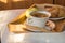 Cup of coffee, Apple on wooden plate closeup. Breakfast, Selective focus