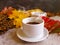 cup of coffee autumn seasonal beverage leaves concrete background