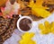 Cup of coffee autumn seasonal vintage autumn beverage leaves concrete background