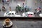 Cup of coffee on balcony table with view of the busy street below